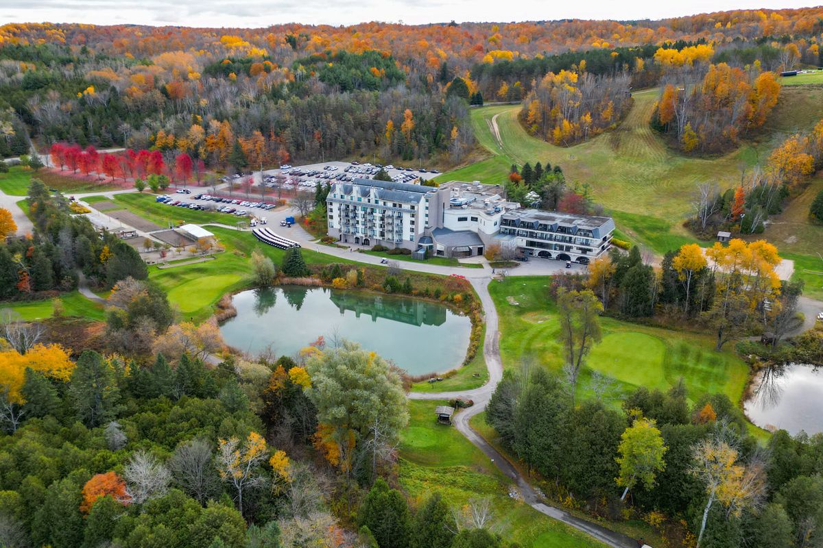 Aerial view of Hockley Valley Resort in Mono, surrounded by fall colours, ponds and golf course