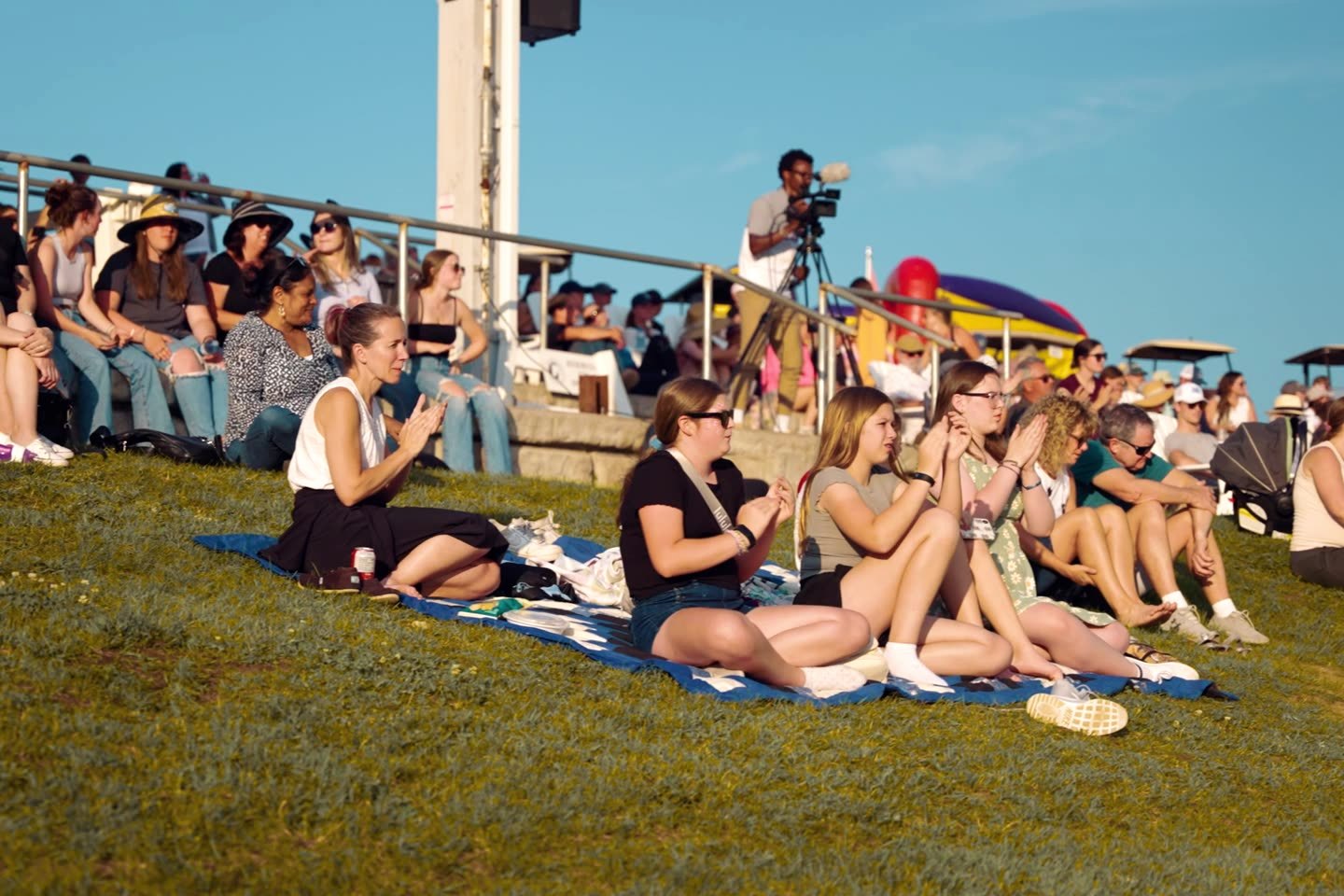 Families and friends watching from the hill at Caledon Equestrian Park