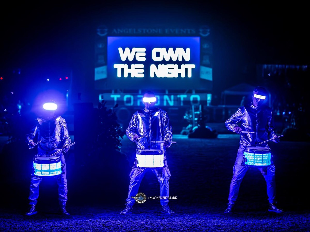 LED drummers under the We Own the Night screen at MLSJ Toronto